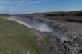 Rainbow over the powerful waterfall Dettifoss in Iceland