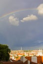 Rainbow over the red roofs of old Prague view of the Prague Castle