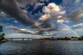 A rainbow over a river in Thailand with a bridge Royalty Free Stock Photo