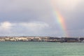 Rainbow over Saint Helier capital city with sea in the foreground, bailiwick of Jersey, Channel Islands, UK Royalty Free Stock Photo