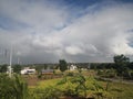 Rainbow over thick dark clouds