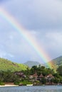 Rainbow over tropical island and luxurious hotel Royalty Free Stock Photo