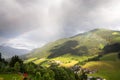 Rainbow over valley with Schattberg Mountain, Saalbach-Hinterglemm, Austria Royalty Free Stock Photo