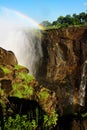 A rainbow over Victoria falls in Zimbabwe, Africa Royalty Free Stock Photo