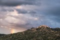 Rainbow over village of Sant`Antonino in Corsica Royalty Free Stock Photo