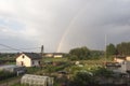 Rainbow over a wooden house Royalty Free Stock Photo