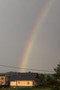 Rainbow over a wooden house Royalty Free Stock Photo