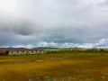 Low Rainbow over barn with green grass - Paso Robles, California Royalty Free Stock Photo