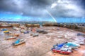 Rainbow at Paignton harbour Devon England uk in colourful HDR with boats and view to Torquay