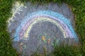 a rainbow painted with colored chalk on a stone Royalty Free Stock Photo