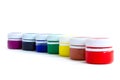 Rainbow paints in jars on an isolated white background Royalty Free Stock Photo