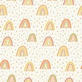 Rainbows and raindrops seamless pattern in orange and yellow .