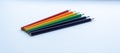 Set of six sharp rainbow-colored pencils except blue on a white background. Selective focus. Royalty Free Stock Photo