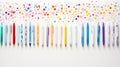 A rainbow of pens on a white background. This image shows a row of colorful pens with different designs and patterns Royalty Free Stock Photo