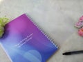 a rainbow pink purple book with motivational words written on a white background