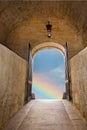 Rainbow in the portal of old medieval stone building