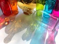 Don't cry over split wine, Reflections colored bottles on to a clear glass bottle. RAINBOW PRIDE Royalty Free Stock Photo