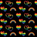 Rainbow pride seamless pattern with hearts and rainbows on black background