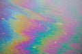 Rainbow puddle after spilled gasoline