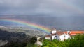 Rainbow, rain and church Royalty Free Stock Photo