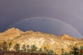 Rainbow after rain over mountains oasis Shebek Tunisia Royalty Free Stock Photo