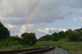 Rainbow in the rain on the railway