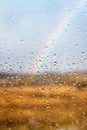 Rainbow through rained window background