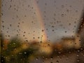 Rainbow through rained window