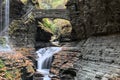 rainbow falls at watkins glen state park (waterfall in a gorge with stone bridge, staircase, rock formation) Royalty Free Stock Photo