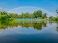 Rainbow reflected on blue River Water