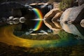 a rainbow reflected in the water of a peaceful waterfall