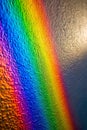 Rainbow reflective light on textured surface Royalty Free Stock Photo