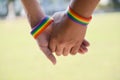 Rainbow rubber wristbands in wrists of asian boy couple