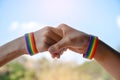 Rainbow rubber wristbands in wrists of asian boy couple