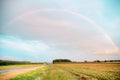 Rainbow Rural landscape with wheat field on sunset Royalty Free Stock Photo