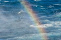 Rainbow on the sea water splash. Royalty Free Stock Photo