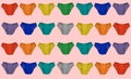 Rainbow set of panties on a pink background, underwear pattern