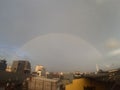 Rainbow shining city in the sky with beautiful fade away colors and it has half circle big curves and also far away