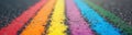 Rainbow sidewalk chalk art creates vibrant pattern on urban pavement. Community expression of positivity, inclusivity. Pride Royalty Free Stock Photo