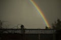 Rainbow in sky. Beautiful weather. Decomposition of light into colors