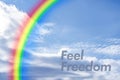 rainbow in the sky clouds with the motivationaltext, feel the freedom and happy life Royalty Free Stock Photo