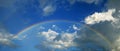 Rainbow with sky and clouds panorama