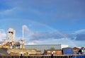 A rainbow in the sky over the cement works.