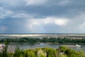 Rainbow in the sky over the river, barges are anchored Royalty Free Stock Photo