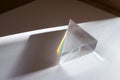 Rainbow spectrum of colors caused by breaking and dispersion of sunlight in a glass prism Royalty Free Stock Photo
