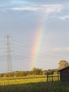 Rainbow spring cloudy sky  village Royalty Free Stock Photo