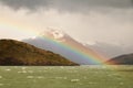 Rugged mountains and a rainbow on Seno de Ultima Esperanza, Patagonia, Chile Royalty Free Stock Photo