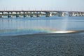 Rainbow on the streams of the fountain against the background of the bridge over the Dnieper River. Royalty Free Stock Photo