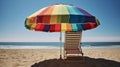 A rainbow-striped beach umbrella shading a lounge chair created with Generative AI Royalty Free Stock Photo