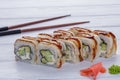 Rainbow Sushi Roll with salmon, eel, tuna, avocado, royal prawn, cream cheese Philadelphia, caviar, chukka. Sushi menu. Japanese f Royalty Free Stock Photo